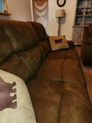 a brown leather couch in a living room at The Ponderosa in Running Springs