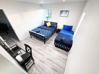 a room with a bed and a couch and a table at Stylish 3 BR/3BR family house in Los Angeles
