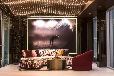 a living room with a couch and a picture of a dog at Fairfax District Chic City Oasis 2 BR Apt with Den 136 in Los Angeles