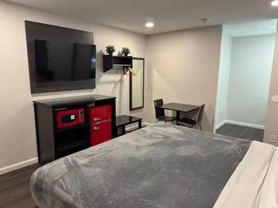 a bedroom with a bed and a flat screen tv at Deep Creek in Arrowbear Lake