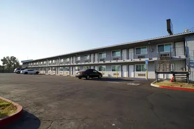 an empty parking lot in front of a building at Airport Stay Motel in Ontario