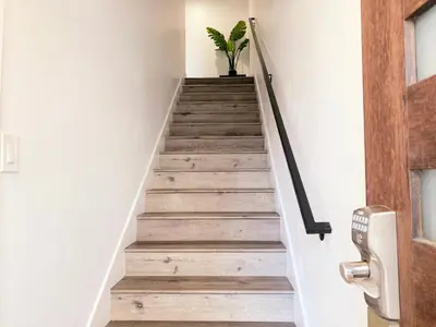 a stairwell in a house with a potted plant at Modern 3BR Home in Mid-City in Los Angeles