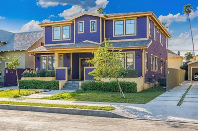 a purple house on a street at Stylish 4 BR house near Korea Town (Central LA) in Los Angeles
