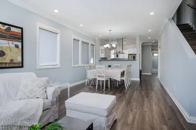 a living room with a white couch and a table at Stylish 4 BR house near Korea Town (Central LA) in Los Angeles