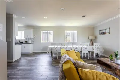 a living room with a couch and a table at Cheerful 5BR house with parking near USC in Los Angeles