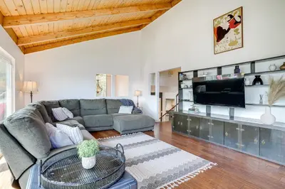 a living room with a couch and a tv at Chic Santa Paula Home with Mountain and City Views! in Santa Paula