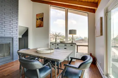 a dining room with a table and chairs and a window at Chic Santa Paula Home with Mountain and City Views! in Santa Paula