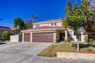 a house with a garage in front of it at The Nest at Woodside: Lux LA getaway + office/spa in Santa Clarita