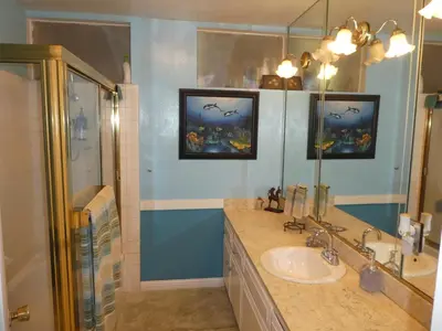 a bathroom with a sink and a shower at Nice Northridge 4-2-2 home near CSUN and Pierce College in Northridge