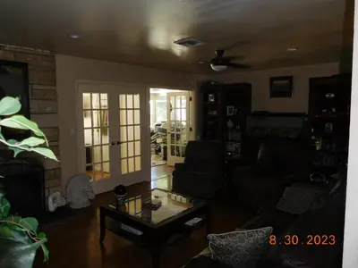 a living room with a couch and a coffee table at Nice Northridge 4-2-2 home near CSUN and Pierce College in Northridge