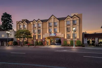 a building on a street in front of a building at Howard Johnson by Wyndham Pasadena in Pasadena