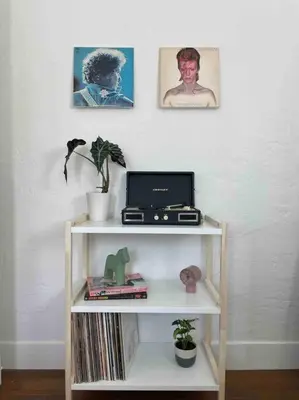 a book shelf with a computer on top of it at Huge Updated Spanish Apt - Steps to Beach & Bay! in Long Beach