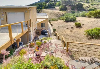 a balcony of a house with a garden at The Creek Retreat - Totally private 1Br/1Bd in Newbury Park