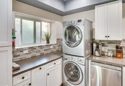 a kitchen with a washer and dryer in it at The Creek Retreat - Totally private 1Br/1Bd in Newbury Park