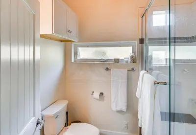 a bathroom with a toilet and a glass shower at The Creek Retreat - Totally private 1Br/1Bd in Newbury Park