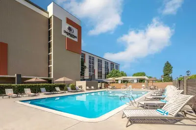 a pool with lounge chairs and a hotel at DoubleTree by Hilton San Bernardino in San Bernardino