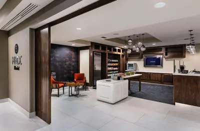 a living room with a kitchen and a dining room at DoubleTree by Hilton San Bernardino in San Bernardino