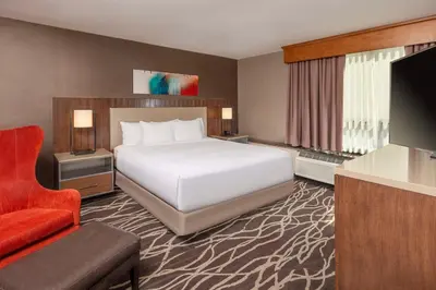 a hotel room with a bed and a television at DoubleTree by Hilton San Bernardino in San Bernardino