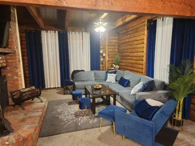 a living room with a blue couch and blue chairs at Pine Mountain Club Family Vacation House in Pine Mountain Club