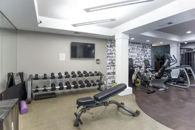 a gym with several treadmills and tread machines at Beverly Hills Penthouse 2 BR Apt with Parking 407 in Los Angeles