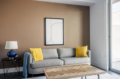 a living room with a gray couch and yellow pillows at Culver City 1br w pool gym easy access to 405 LAX-1136 in Los Angeles