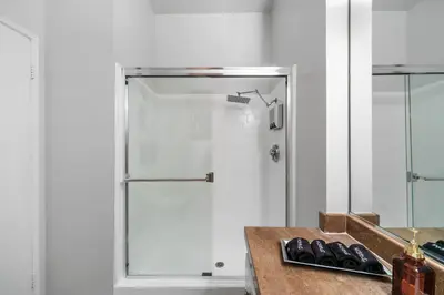 a shower in a bathroom with a glass door at Beverly Hills 2 bed 2 bath Penthouse with Den and Parking 414 in Los Angeles