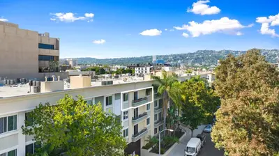 a view of a city from a building at Beverly Hills 2 bed 2 bath Penthouse with Den and Parking 414 in Los Angeles