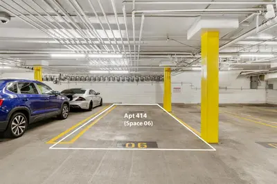 a parking garage with two cars parked in it at Beverly Hills 2 bed 2 bath Penthouse with Den and Parking 414 in Los Angeles