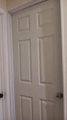 a white door with a window in a room at Zen Home in Santa Ana