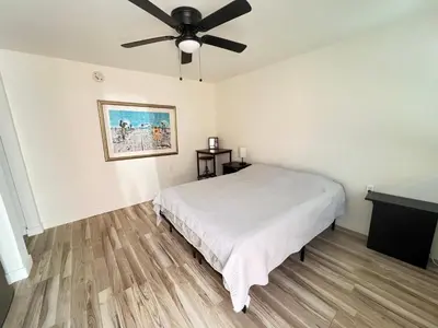 a bedroom with a bed and a ceiling fan at Little Betty's Casita in Torrance