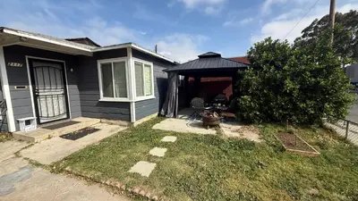 a small house with a gazebo in the yard at Little Betty's Casita in Torrance