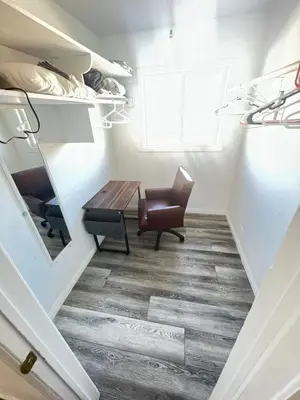 a room with a desk and a chair and a mirror at Little Betty’s Hideaway in Torrance