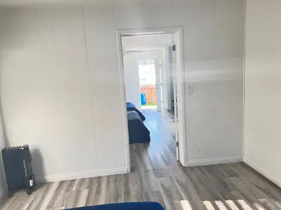 a room with a door open to a bedroom at Little Betty’s Hideaway in Torrance