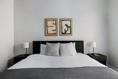a bedroom with a large bed with two pictures on the wall at Marina Del Rey 1br w lounge gym spa nr marina LAX-1074 in Los Angeles