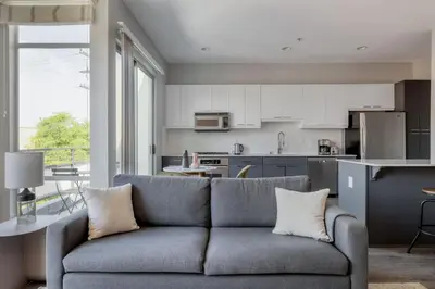a living room with a couch and a kitchen at Marina Del Rey 1br w lounge gym spa nr marina LAX-1074 in Los Angeles