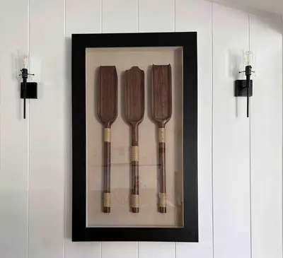 a framed picture of four kitchen utensils on a wall at Malibou Lake Oasis in Agoura Hills