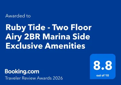 a blue sign with the words ruby tribe two floor at a two floor at at Ruby Tide - Two Floor Airy 2BR Marina Side Exclusive Amenities in Los Angeles