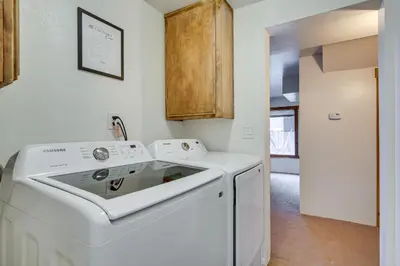 a white washer and dryer in a kitchen at The Abby Cabin Restful Running Springs Retreat! in Running Springs