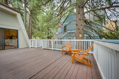 a wooden deck with a bench and a house at The Abby Cabin Restful Running Springs Retreat! in Running Springs
