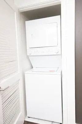 a white refrigerator with a microwave on top of it at Luxury 2Bed/2Bath Apt in West Hollywood w/ Rooftop in Los Angeles