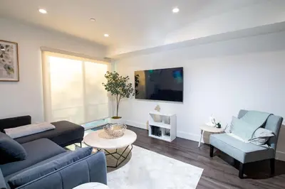 a living room with a couch and a table at Luxury 2Bed/2Bath Apt in West Hollywood w/ Rooftop in Los Angeles
