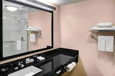 a bathroom with a sink and a mirror at Fairfield Inn & Suites by Marriott Los Angeles LAX/El Segundo in El Segundo