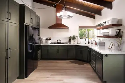a kitchen with green cabinets and a sink at Large A-Frame Cabin (9 Beds, AC, + Lake Access) in Lake Arrowhead