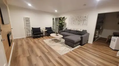 a living room with a couch and a table at Beautiful Bright Condo Steps Away from the Beach in Long Beach