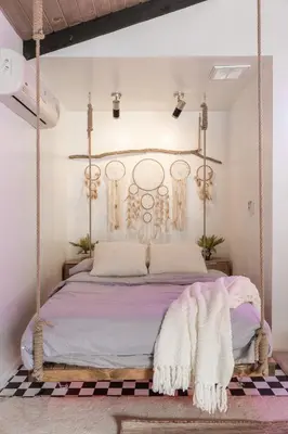 a bedroom with a hanging bed with purple sheets at Angel&Rose Universal Hollywood Heated Pool House King Bed in Los Angeles