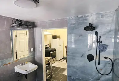 a bathroom with a shower and a sink at Los Angeles Zen Home in Los Angeles