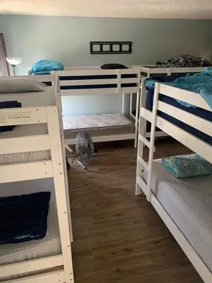 a room with three bunk beds in a room at Los Angeles Zen Home in Los Angeles