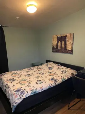 a bedroom with a bed and a painting on the wall at Los Angeles Zen Home in Los Angeles