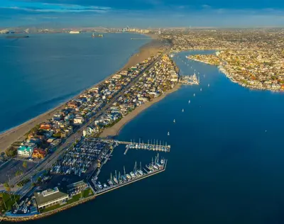 an aerial view of a harbor with a bunch of boats at Peninsula Hideaway Apartment • Alamitos Bay in Long Beach