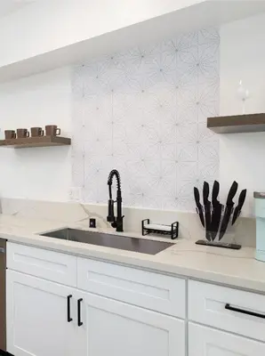 a kitchen with a sink and a counter top at Fenix Hotel Hollywood in Los Angeles